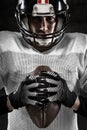 Portrait of american football player holding a ball Royalty Free Stock Photo