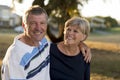 Portrait of American senior beautiful and happy mature couple around 70 years old showing love and affection smiling together in t