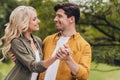 Portrait of amorous coquettish flirty attractive cheerful couple spending free time dancing enjoying outdoors Royalty Free Stock Photo