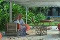 Amusing happy smiling old couple at cafe table