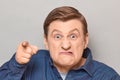 Portrait of angry annoyed man with pointing with index finger at you Royalty Free Stock Photo