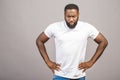 Portrait of angry or annoyed young African American man in casual looking at the camera with displeased expression. Negative human Royalty Free Stock Photo