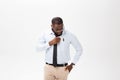 Portrait of angry or annoyed young African American man in white polo shirt looking at the camera with displeased Royalty Free Stock Photo