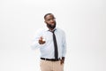 Portrait of angry or annoyed young African American man in white polo shirt looking at the camera with displeased Royalty Free Stock Photo