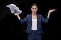 Portrait of angry asian businesswoman holding documents Royalty Free Stock Photo