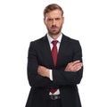 Portrait of angry businessman with folded arms standing