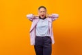 Portrait of angry businesswoman covering her ears, stop making that loud noise giving me a headache Royalty Free Stock Photo