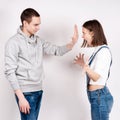 Portrait of an angry couple shouting each other against white background Royalty Free Stock Photo