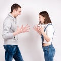 Portrait of an angry couple shouting each other against white background Royalty Free Stock Photo