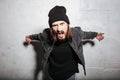 Portrait of an angry hipster guy shouting on camera Royalty Free Stock Photo