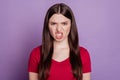 Portrait of angry mad aggressive woman look camera grin teeth on purple background Royalty Free Stock Photo