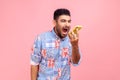 Portrait of angry mad man with beard in blue casual shirt loudly screaming talking phone, leaving Royalty Free Stock Photo