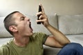 Angry man yelling on the phone Royalty Free Stock Photo