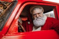 Portrait of an angry Santa Claus driving. Aggressive driver, new year, christmas. Santa Claus is preparing for Christmas Royalty Free Stock Photo