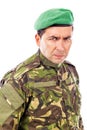 Portrait of an angry soldier with green beret