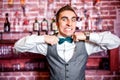 Portrait of angry and stressed bartender or barman with bowtie