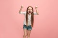 Portrait of angry teen girl on a pink studio background Royalty Free Stock Photo