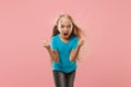 Portrait of angry teen girl on a pink studio background Royalty Free Stock Photo