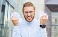 Portrait of an angry, tired businessman yelling and throwing business papers Royalty Free Stock Photo