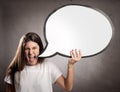 Portrait of angry young girl holding a speech bubble Royalty Free Stock Photo