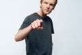 Portrait of Angry Young Man Pointing Forefinger