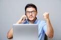 Portrait of angry young man screaming on his mobile phone Royalty Free Stock Photo