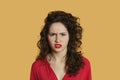 Portrait of angry young woman frowning over colored background Royalty Free Stock Photo