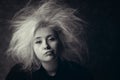 Portrait of annoyed girl with disheveled hair, photo in black and white. Royalty Free Stock Photo