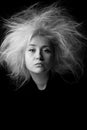 Portrait of annoyed girl with disheveled hair, photo in black and white. Royalty Free Stock Photo