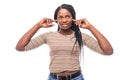 Portrait annoyed, unhappy, stressed african woman covering her ears, looking up stop making loud noise isolated on white Royalty Free Stock Photo