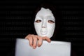 Portrait of anonymous man with white mask isolated on black Royalty Free Stock Photo