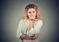 Portrait anxious woman biting her fingernails craving for something Royalty Free Stock Photo