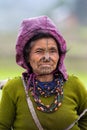 The portrait of Apatani women with her nose plug and tattoos.