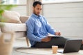 Portrait of Arab man using laptop and writing Royalty Free Stock Photo