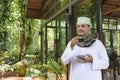 Portrait of Arab muslim handsome man in white thobe with prayer