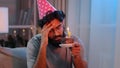 Portrait Arabian sad upset lonely Indian bearded man celebrate birthday alone without friends feel sadness headache