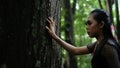 Portrait of archery woman walking fearlessly when seeing something and bravely in the jungle