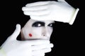 Portrait of artful peeping mime