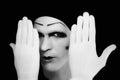 Portrait of artful peeping mime in white gloves Royalty Free Stock Photo