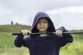 Portrait of Asean boy holding a wooden sword play