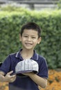 Portrait of Asean boy , laughing and smiling happily in the park