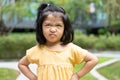 Portrait of an Asian angry and sad little girl. The emotion of a child when tantrum and mad, expression of grumpy emotion. Kid Royalty Free Stock Photo