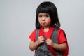 Portrait of Asian angry and sad little girl on white isolated background, The emotion of a child when tantrum and mad, expression Royalty Free Stock Photo