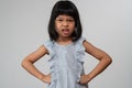 Portrait of Asian angry and sad little girl on white isolated background, The emotion of a child when tantrum and mad, expression Royalty Free Stock Photo