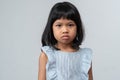 Portrait of Asian angry and sad little girl on white isolated background, The emotion of a child when tantrum and mad, expression Royalty Free Stock Photo