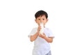 Portrait of asian baby boy drinking milk from glass bottle isolated on white background Royalty Free Stock Photo