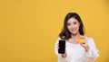 Portrait Asian beautiful happy young woman smiling cheerful and she is holding credit card and using smart phone for shopping Royalty Free Stock Photo