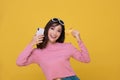 Portrait Asian beautiful happy young woman smiling cheerful and she is holding credit card and using smart phone for shopping Royalty Free Stock Photo