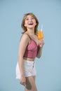 Portrait Asian beautiful happy young woman with sunglasses smiling cheerful and Holding a glass of orange juice in summer on Royalty Free Stock Photo