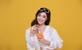 Portrait Asian beautiful happy young woman with sunglasses  smiling cheerful and Holding a glass of orange juice in summer and Royalty Free Stock Photo